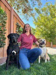 A woman with her two lovely dogs