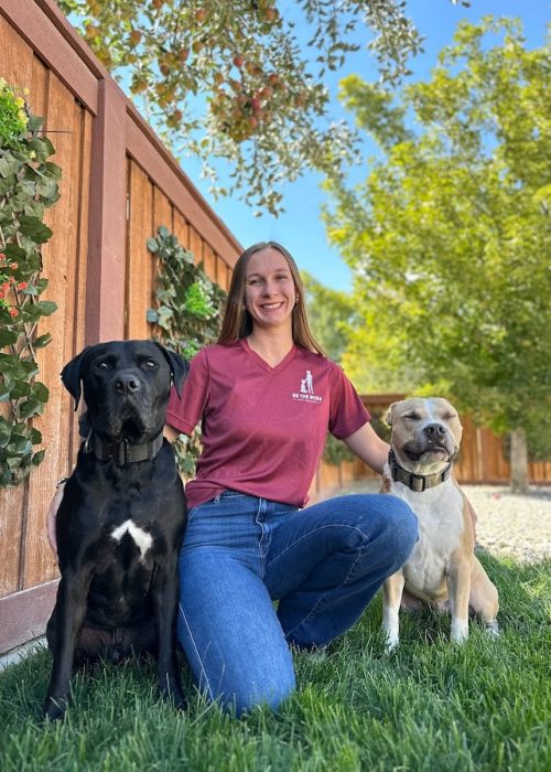 A woman with her two lovely dogs